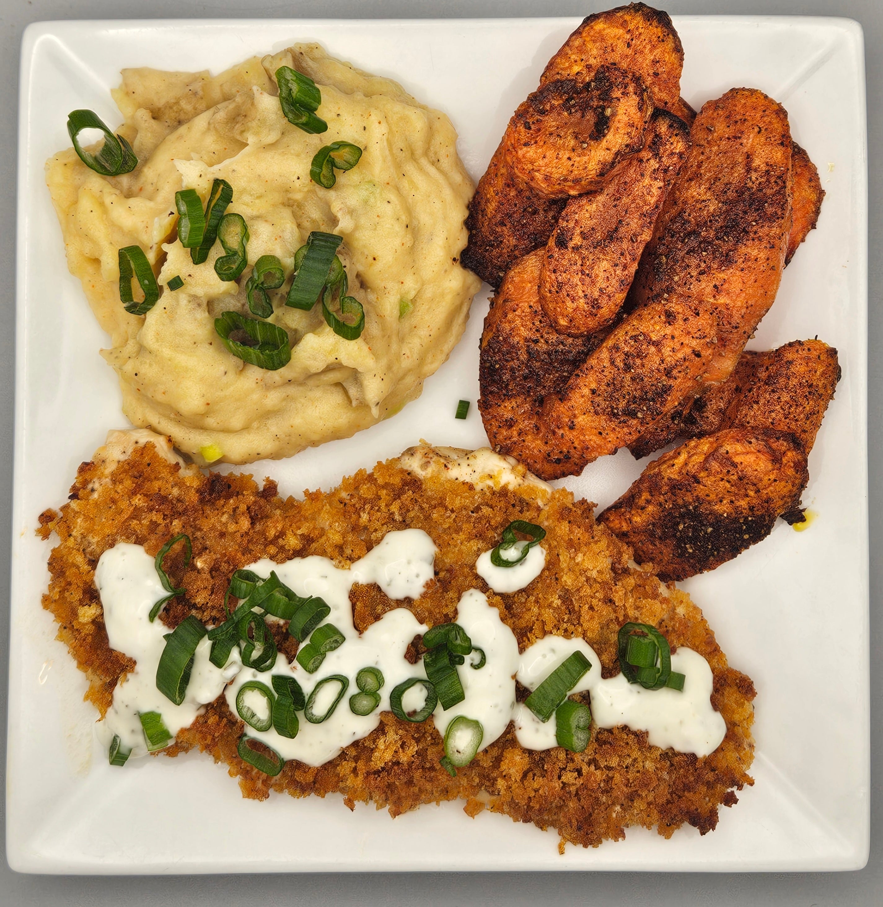 Crispy Buffalo Chicken with Mashed Potatoes & Roasted Carrot Medallions