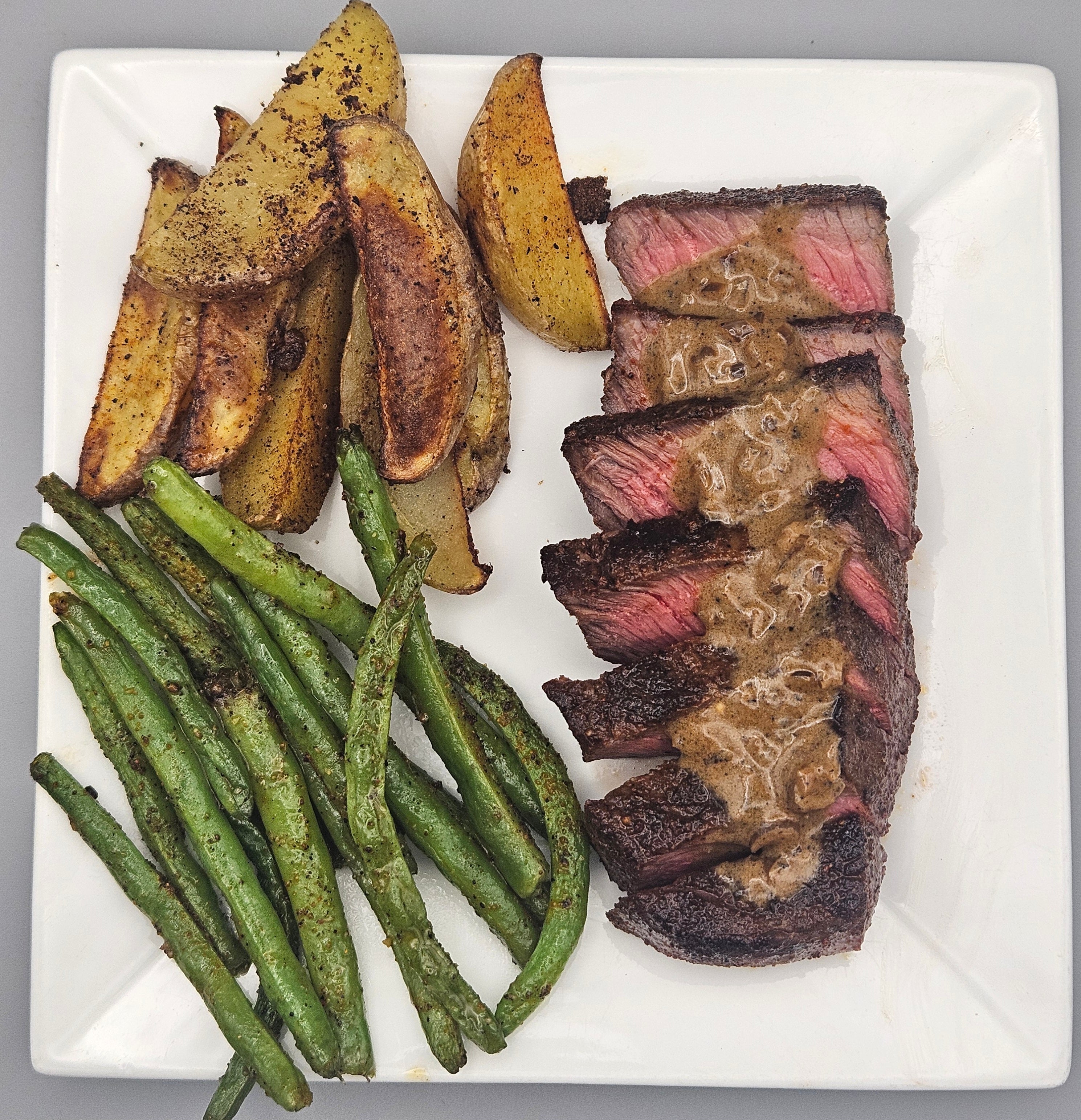 Steak with Creamy Pepper Shallot Sauce, Roasted Potatoes, and Green Beans