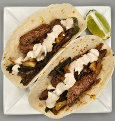 Steak Taco Tuesday with Fajita Veggies, Charred Pineapple, and Chipotle Lime Crema