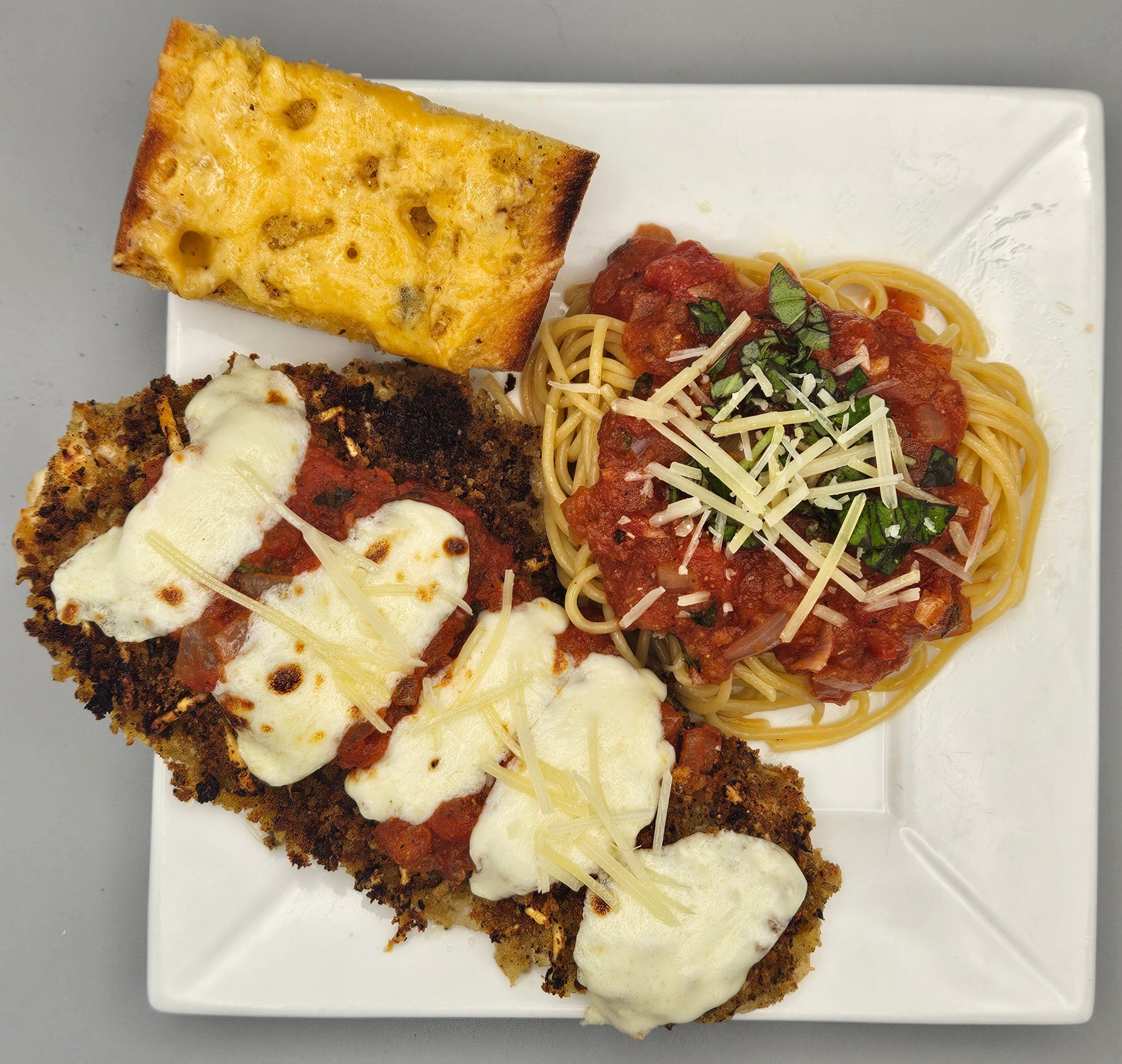 Chicken Parmesan with Spaghetti Marinara and Garlic Cheese Bread