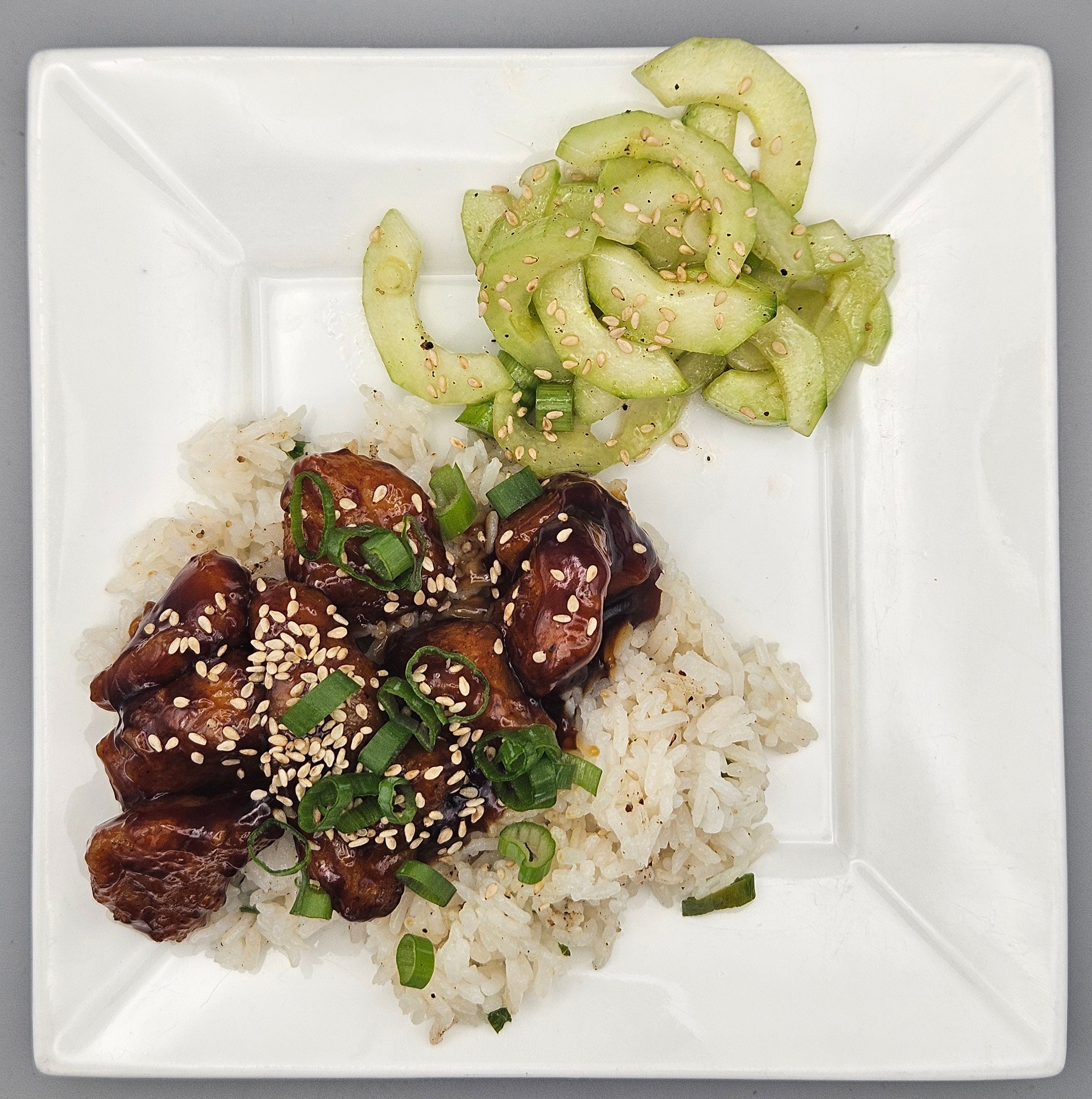 Korean Inspired Chicken over Jasmine Rice with a Cucumber Salad